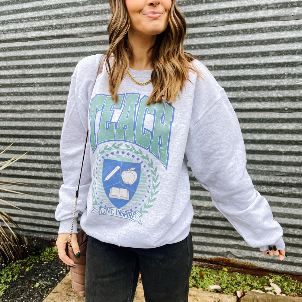 
                      
                        Teacher Crest Sweatshirt
                      
                    