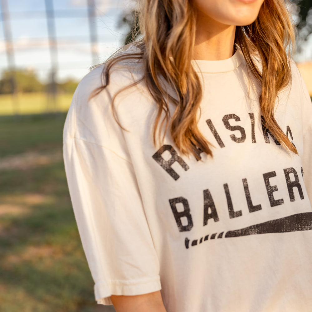 
                      
                        Raising Ballers Tee
                      
                    